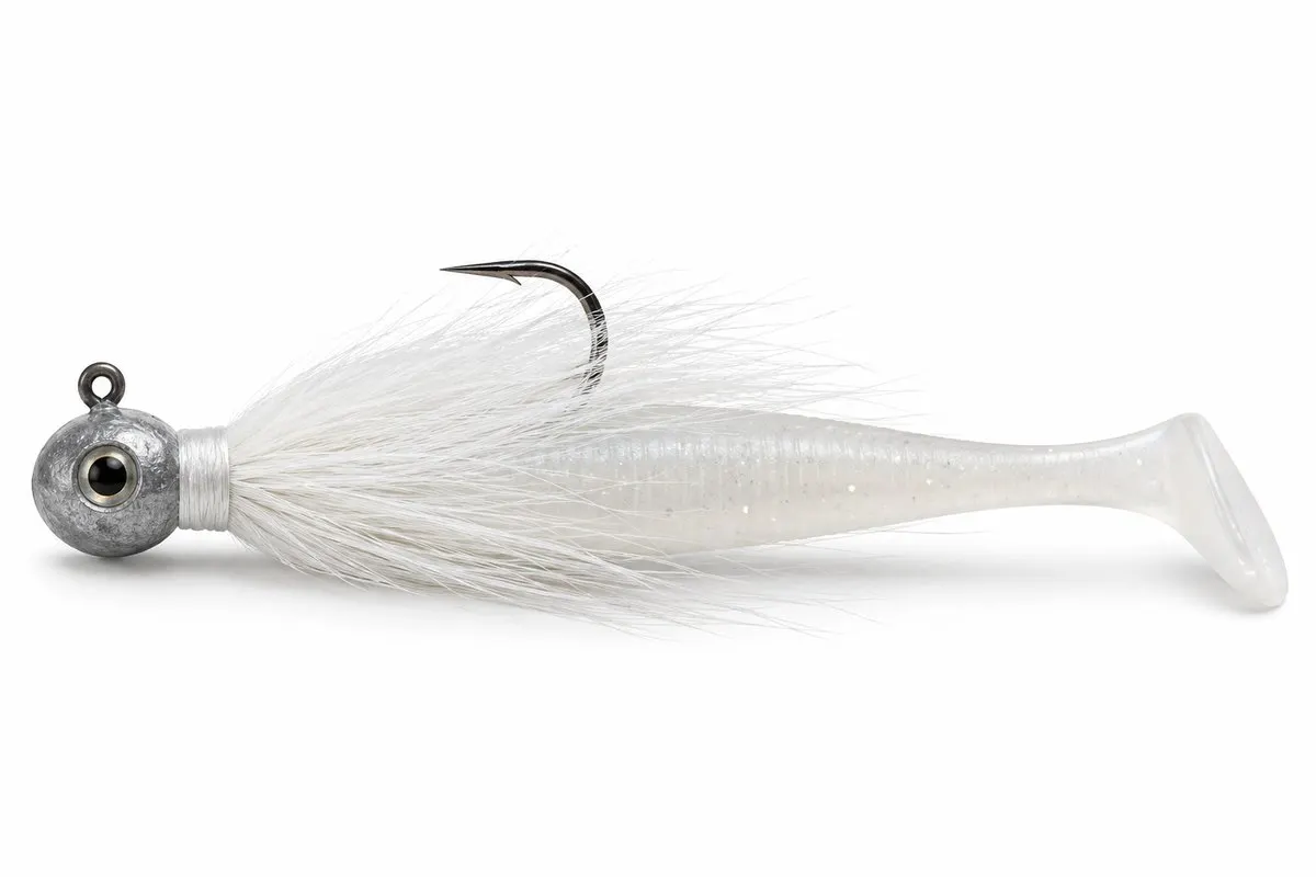 A bucktail jighead rigged with a white paddle-tail soft plastic