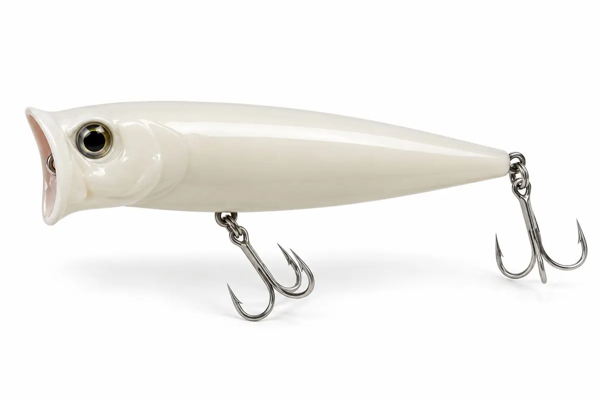 A white topwater popper plug with treble hooks